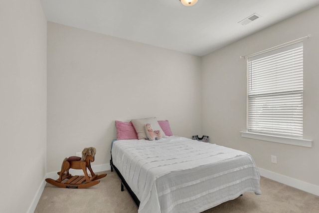 bedroom with light colored carpet