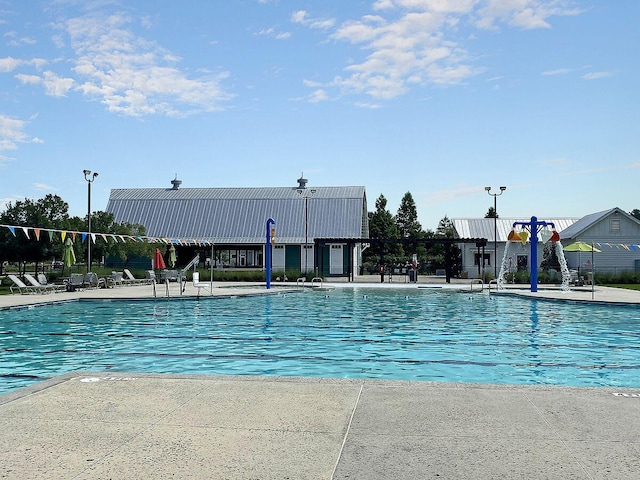 view of swimming pool with a patio