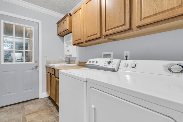 1613 Cavanaugh Rd, Walterboro, SC 29488 - washroom featuring separate washer and dryer, cabinet space, and crown molding