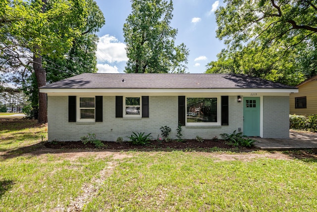 2219 Eagle Dr, North Charleston, SC 29406 - ranch-style home featuring brick siding, a shingled roof, and a front yard