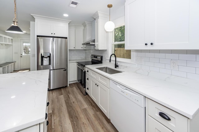2219 Eagle Dr, North Charleston, SC 29406 - kitchen with stainless steel appliances, visible vents, white cabinetry, and a sink