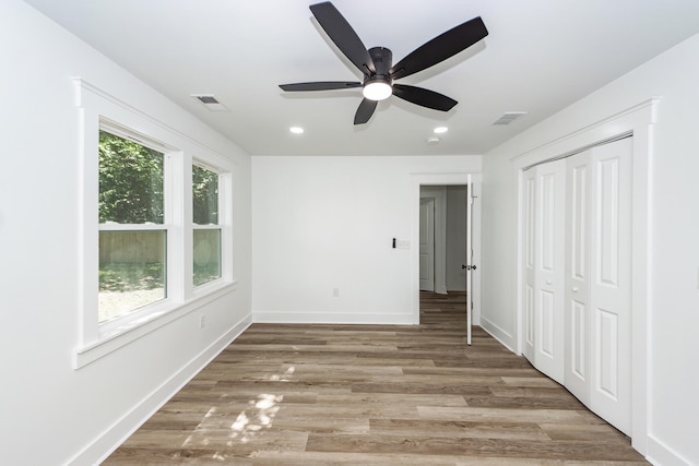 2219 Eagle Dr, North Charleston, SC 29406 - unfurnished bedroom featuring visible vents, baseboards, a closet, and light wood-type flooring