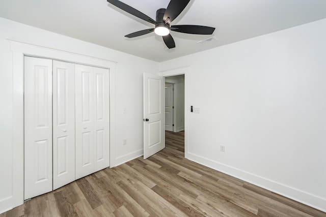 2219 Eagle Dr, North Charleston, SC 29406 - unfurnished bedroom with baseboards, wood finished floors, visible vents, and a closet