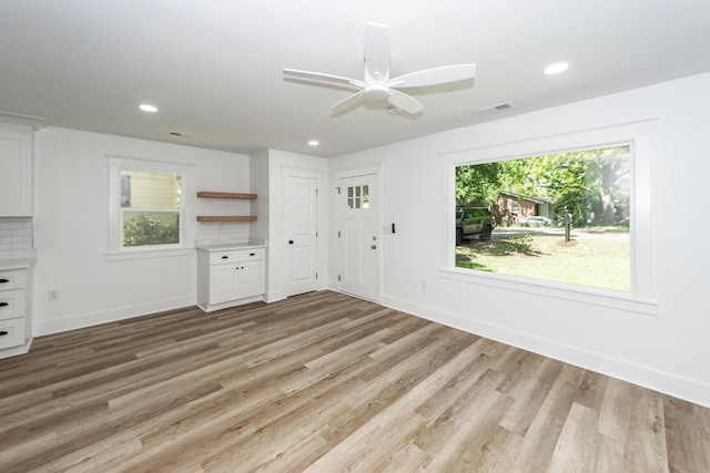 2219 Eagle Dr, North Charleston, SC 29406 - unfurnished living room with visible vents, light wood-style flooring, baseboards, and recessed lighting