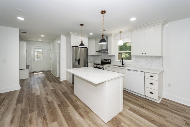 2219 Eagle Dr, North Charleston, SC 29406 - kitchen with a sink, white cabinets, backsplash, and stainless steel appliances