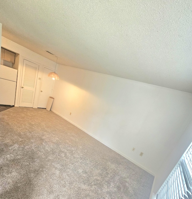 2494 Etiwan Ave Unit 9-D, Charleston, SC 29414 - carpeted spare room featuring a textured ceiling and baseboards