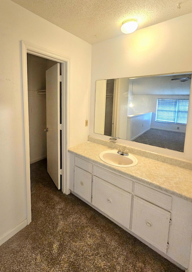 2494 Etiwan Ave Unit 9-D, Charleston, SC 29414 - bathroom featuring vanity, a textured ceiling, and carpet