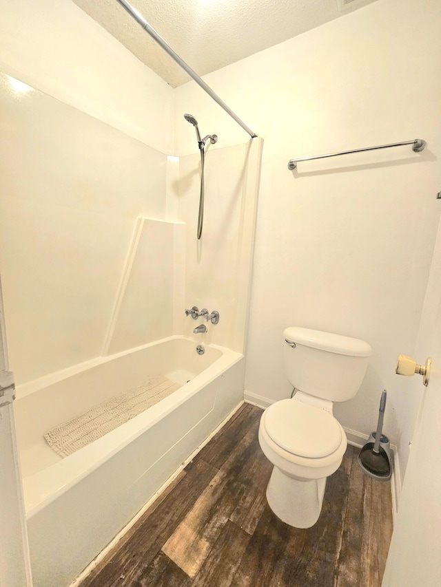 2494 Etiwan Ave Unit 9-D, Charleston, SC 29414 - bathroom featuring wood finished floors, toilet, bathtub / shower combination, and baseboards