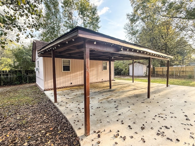 view of patio featuring a storage shed