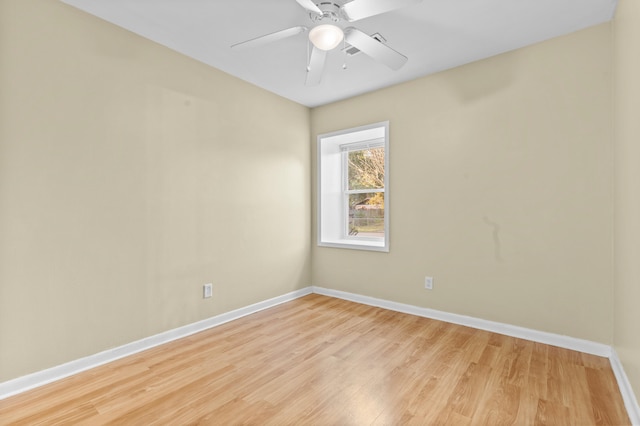 empty room with light hardwood / wood-style flooring and ceiling fan