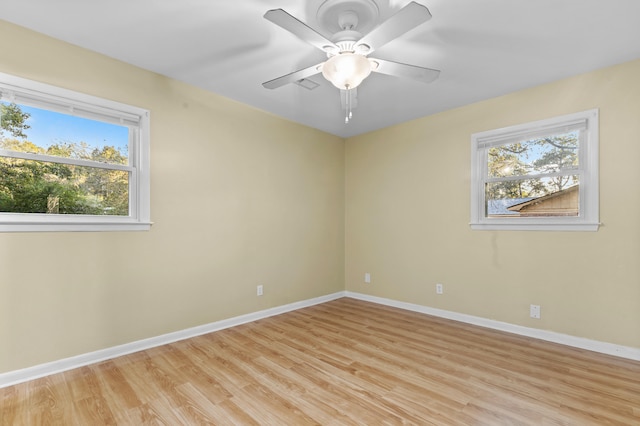 unfurnished room with ceiling fan and light hardwood / wood-style flooring