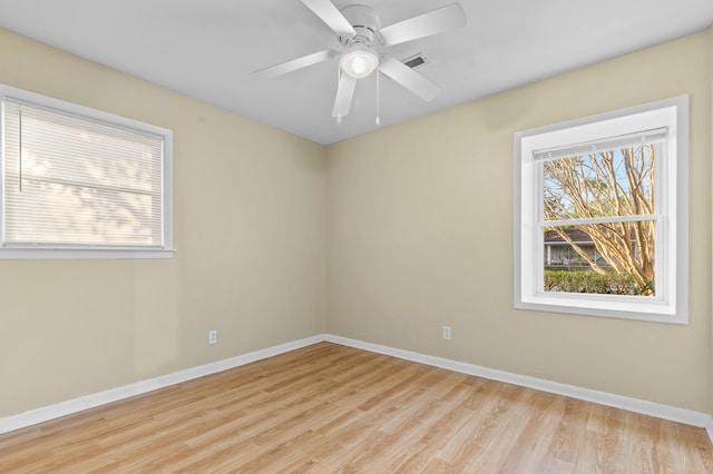 unfurnished room with ceiling fan and light hardwood / wood-style floors