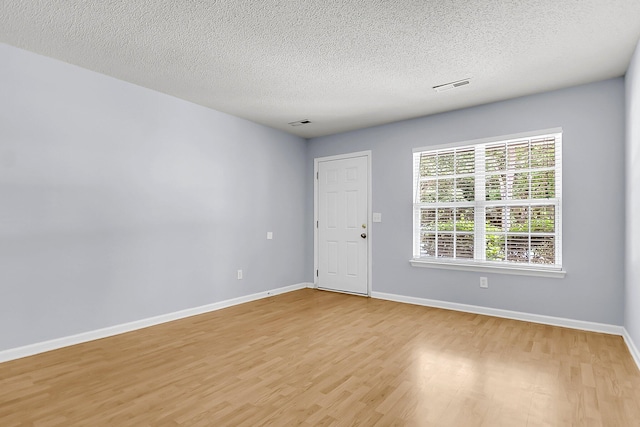 230 Darcy Ave, Goose Creek, SC 29445 - unfurnished room with light wood-style flooring, baseboards, and a textured ceiling
