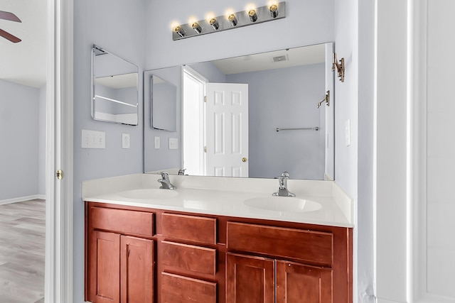 230 Darcy Ave, Goose Creek, SC 29445 - full bath with double vanity, a ceiling fan, and baseboards