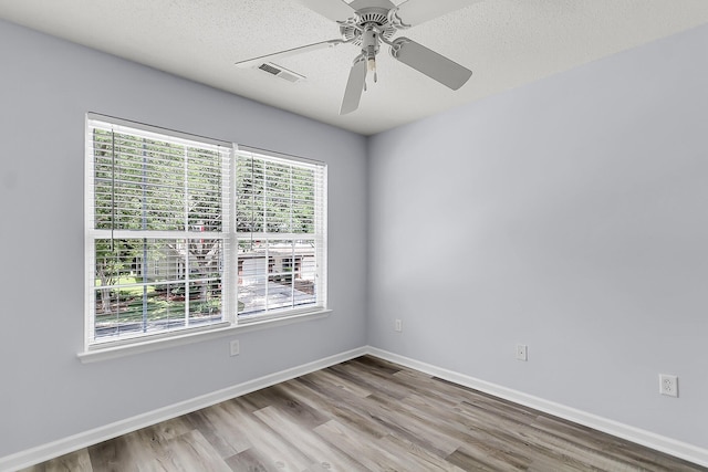 230 Darcy Ave, Goose Creek, SC 29445 - empty room with wood finished floors, a ceiling fan, baseboards, and a textured ceiling
