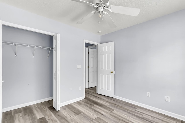 230 Darcy Ave, Goose Creek, SC 29445 - unfurnished bedroom featuring wood finished floors, a closet, baseboards, and ceiling fan