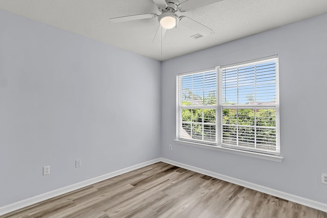 230 Darcy Ave, Goose Creek, SC 29445 - empty room with light wood-style floors, baseboards, ceiling fan, and a textured ceiling