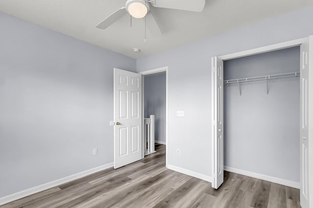 230 Darcy Ave, Goose Creek, SC 29445 - unfurnished bedroom with wood finished floors, a closet, baseboards, and ceiling fan
