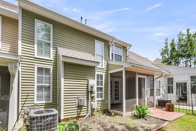 230 Darcy Ave, Goose Creek, SC 29445 - rear view of house featuring a sunroom, central air condition unit, and roof with shingles