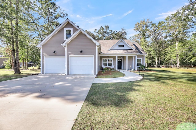 view of front of home featuring a front yard, a garage, and covered porch