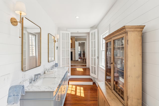 bathroom with vanity and hardwood / wood-style flooring