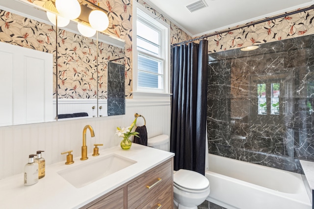 full bathroom with shower / tub combo with curtain, vanity, and toilet