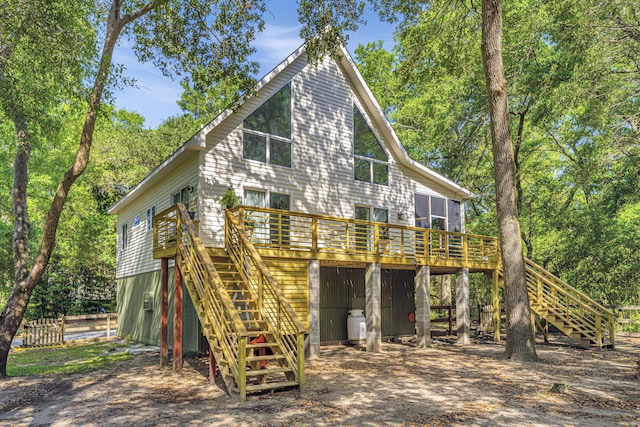 2468 Marina Rd, Wadmalaw Island, SC 29487 - back of property featuring stairway, a wooden deck, and view of scattered trees