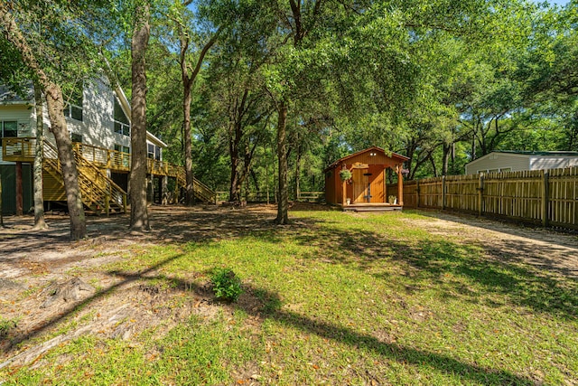 2468 Marina Rd, Wadmalaw Island, SC 29487 - view of yard with stairs, a storage shed, an outbuilding, and a deck