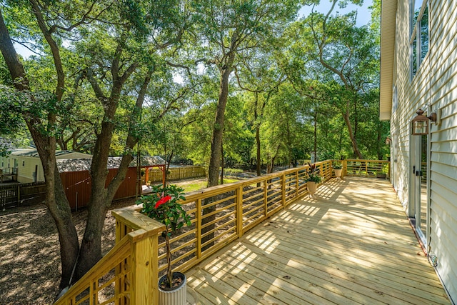 2468 Marina Rd, Wadmalaw Island, SC 29487 - deck featuring fence and view of scattered trees