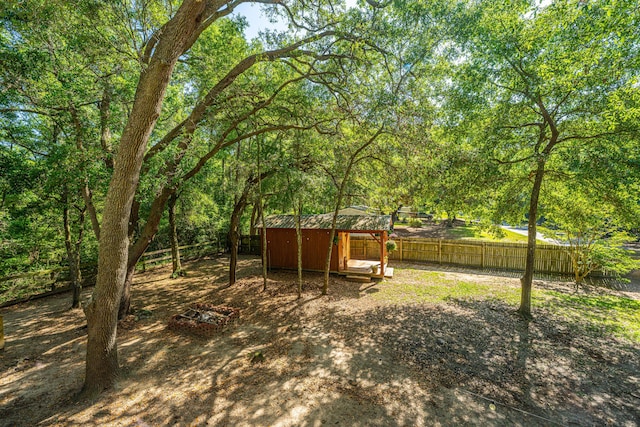 2468 Marina Rd, Wadmalaw Island, SC 29487 - fenced backyard with an outbuilding