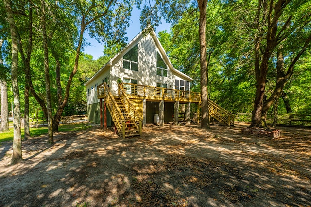 2468 Marina Rd, Wadmalaw Island, SC 29487 - back of house featuring stairs, a deck, and fence
