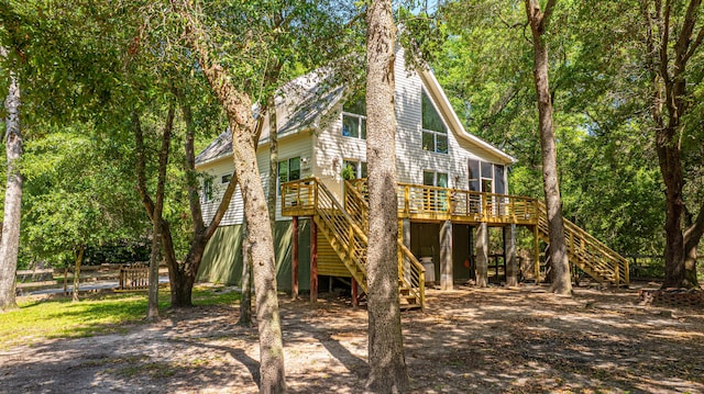 2468 Marina Rd, Wadmalaw Island, SC 29487 - rear view of house featuring stairs, a wooden deck, and fence