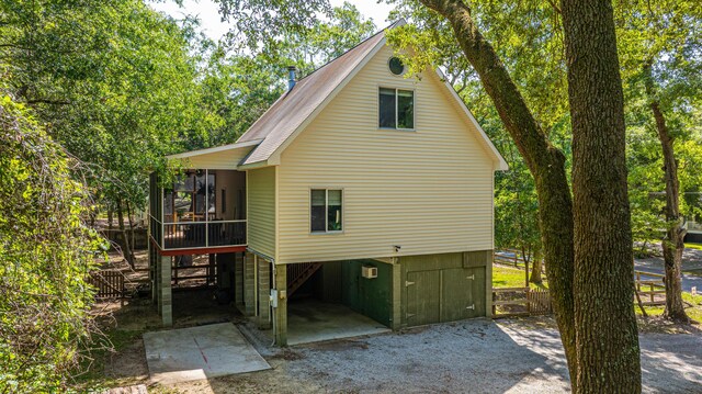 2468 Marina Rd, Wadmalaw Island, SC 29487 - rear view of house with a sunroom and a carport