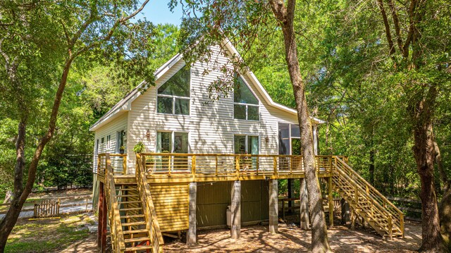 2468 Marina Rd, Wadmalaw Island, SC 29487 - back of house featuring stairs, a wooden deck, and fence