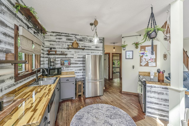 2468 Marina Rd, Wadmalaw Island, SC 29487 - kitchen featuring freestanding refrigerator, wood counters, a sink, open shelves, and black microwave
