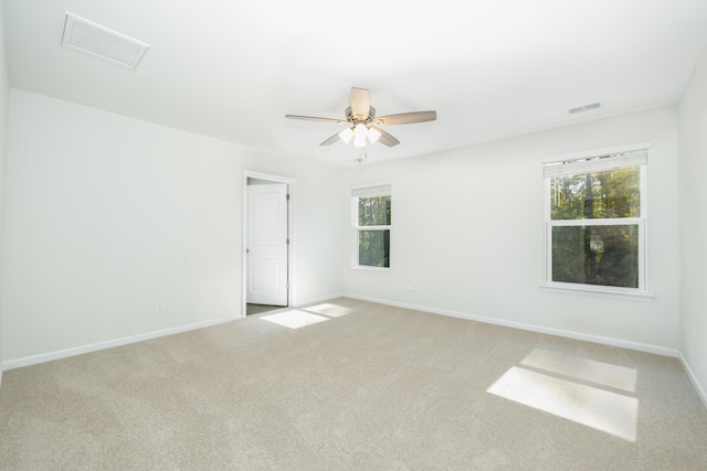 carpeted empty room with ceiling fan