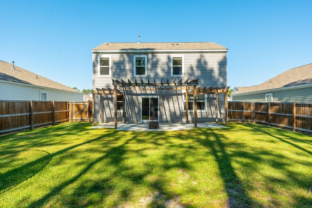 rear view of house featuring a patio, a lawn, and a pergola