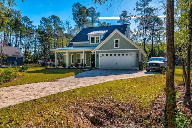 view of front facade with a garage, covered porch, and a front lawn