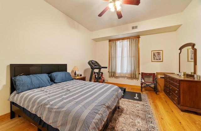 bedroom with light hardwood / wood-style flooring and ceiling fan