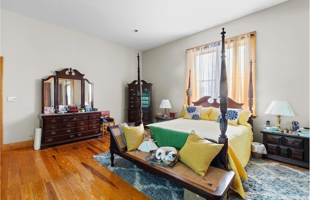 bedroom with hardwood / wood-style floors