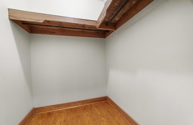 spacious closet featuring hardwood / wood-style floors