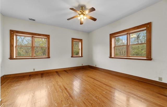 spare room with ceiling fan and light hardwood / wood-style flooring