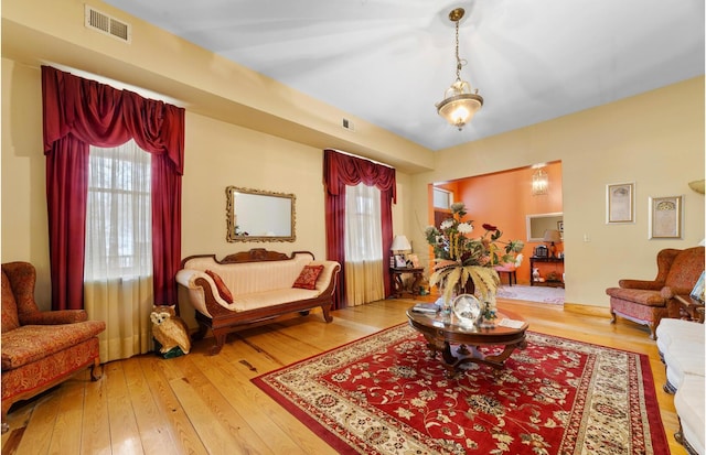 sitting room with hardwood / wood-style flooring