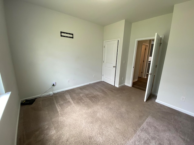 unfurnished bedroom with carpet flooring