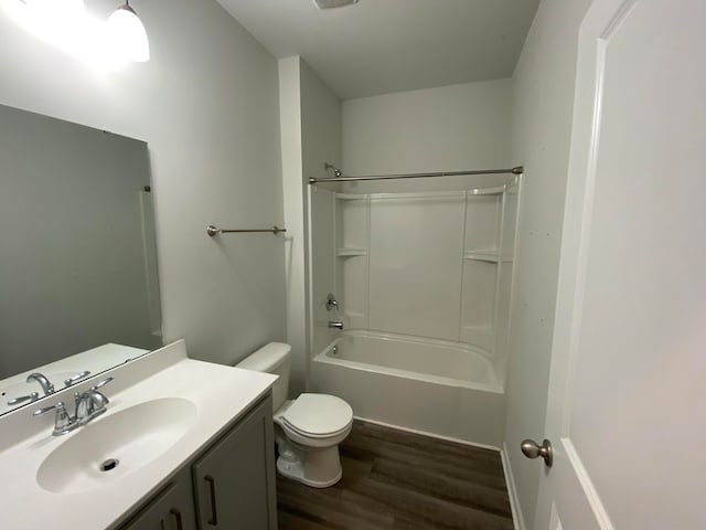 full bathroom featuring vanity, wood-type flooring, toilet, and tub / shower combination