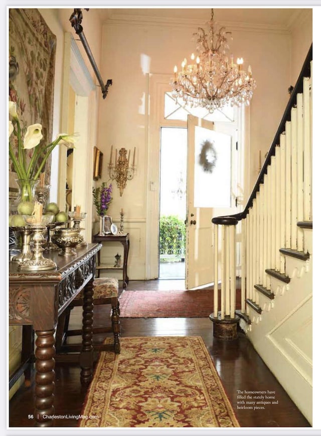 81 Rutledge Ave, Charleston, SC 29401 - foyer featuring stairs, wood finished floors, a chandelier, and ornamental molding