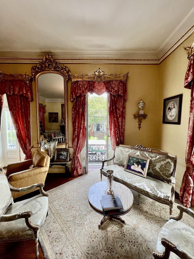 81 Rutledge Ave, Charleston, SC 29401 - living area featuring crown molding, wood finished floors, and arched walkways
