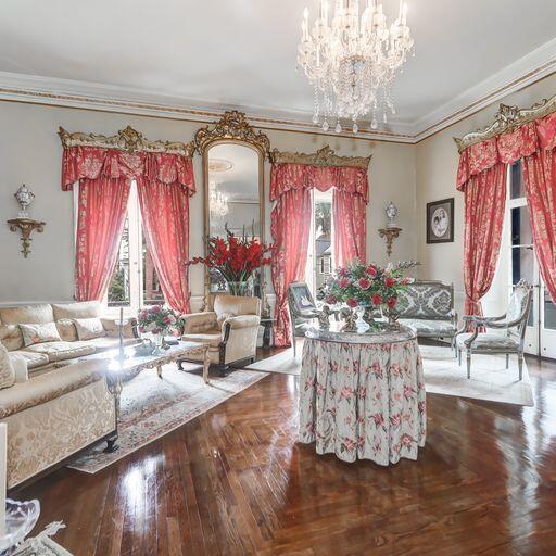 81 Rutledge Ave, Charleston, SC 29401 - living room featuring crown molding and a chandelier