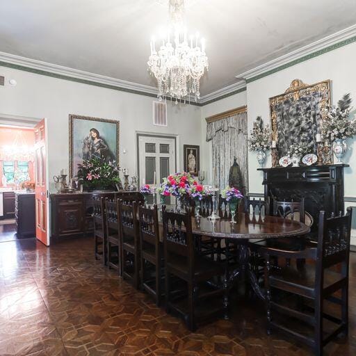 81 Rutledge Ave, Charleston, SC 29401 - dining space with a chandelier and ornamental molding