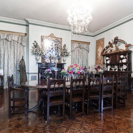 81 Rutledge Ave, Charleston, SC 29401 - dining room featuring a chandelier and crown molding